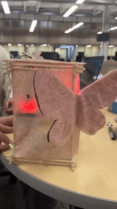 The final product features a white light sensor that responds to ultrasonic waves, a red light sensor that detects heartbeats, and a blue light sensor that responds to sound.